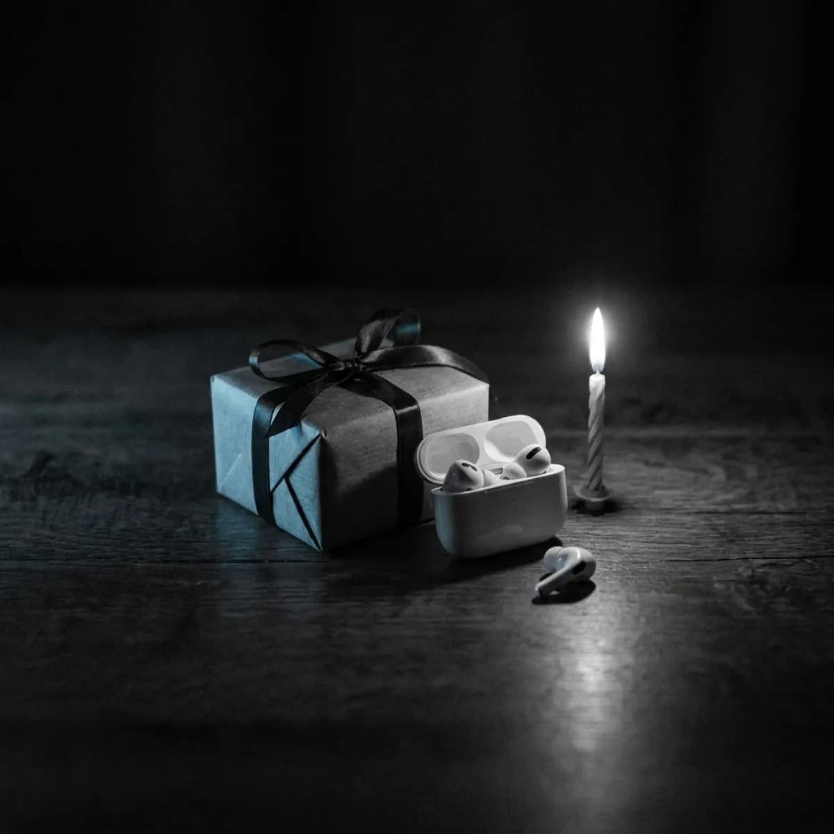 A wrapped present beside a phone playing a personal song